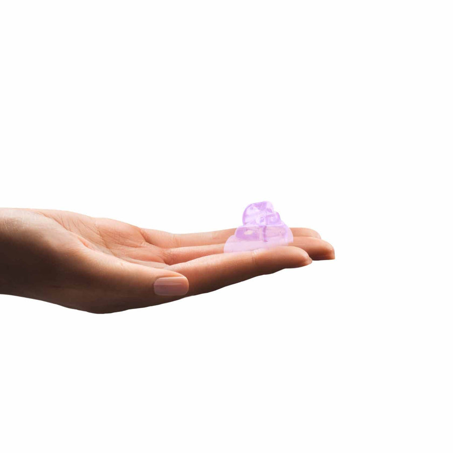 Detail view of Simplehuman Lavender Liquid Hand Soap, showing the rich purple color and texture in a palm.